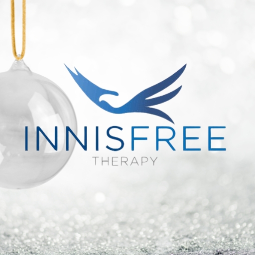 Innisfree Therapy bird logo over a silver and glass bauble background