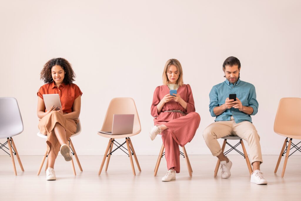 random people looking at their mobile phones, concept of internet addiction