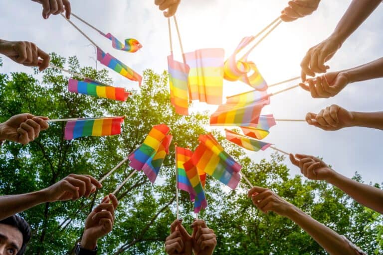 LGBTQ Rainbow Flags being waved symbol of Diversity Gay and lesbian for Celebration gay pride parade