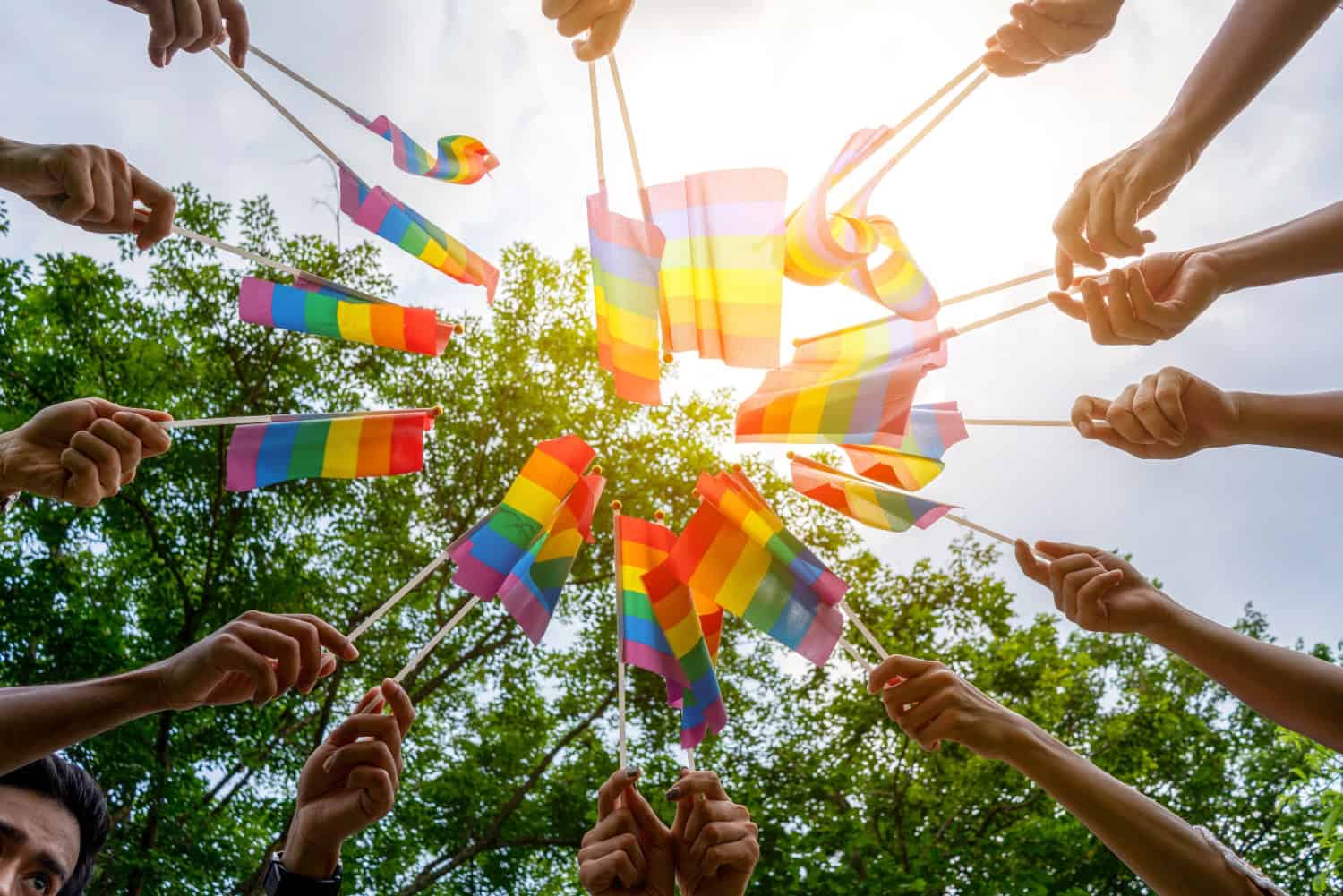 LGBTQ Rainbow Flags being waved symbol of Diversity Gay and lesbian for Celebration gay pride parade