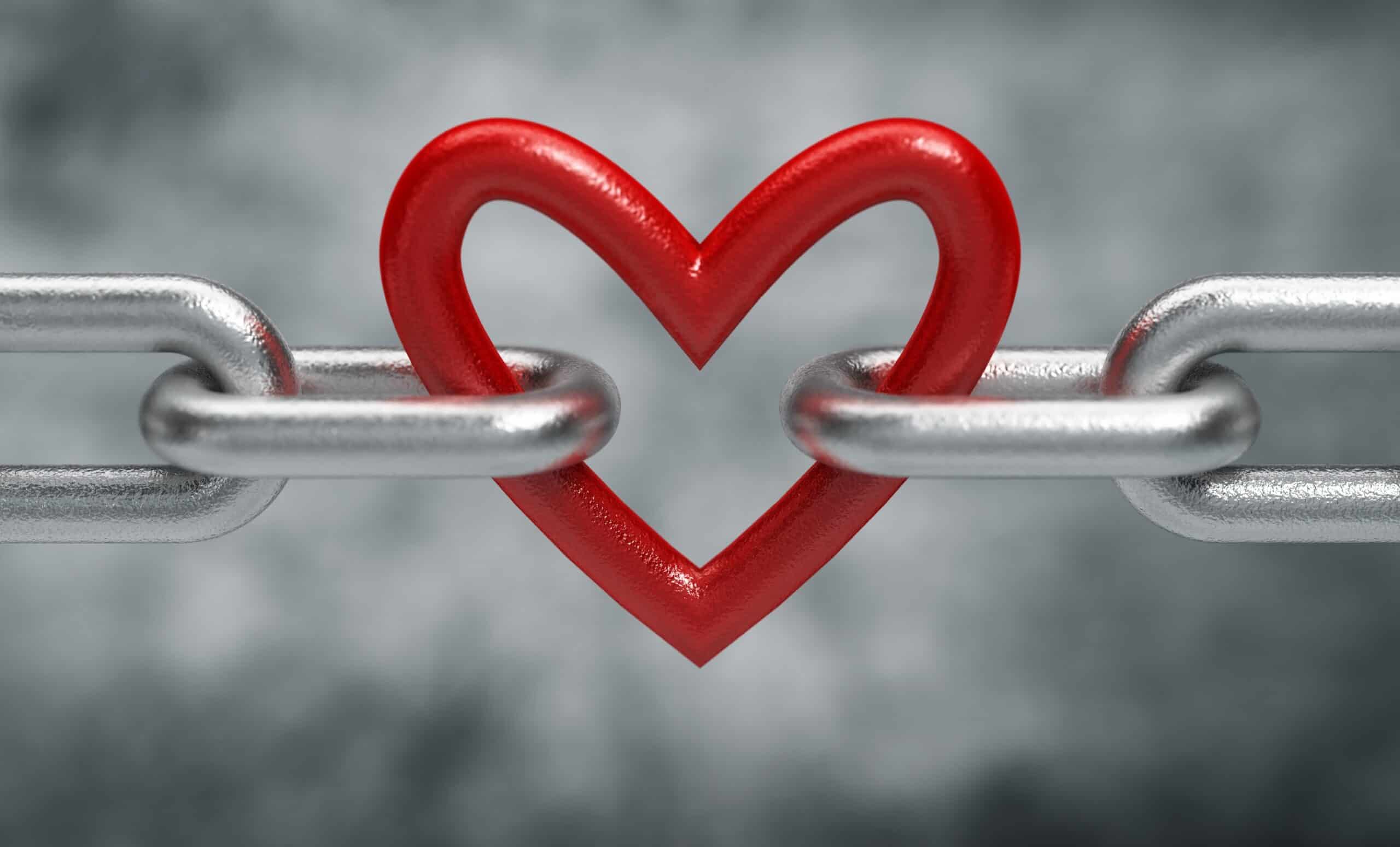 image of a heart connected to a chain, concept of love, codependency, and attachment trauma