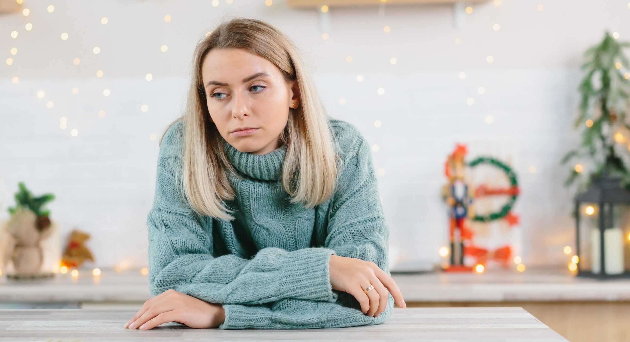 woman feeling sad, depressed during holiday season