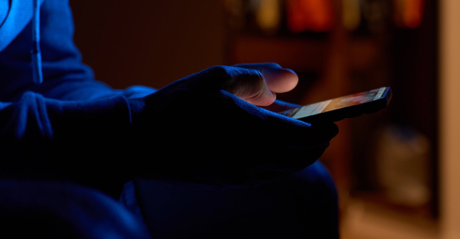using smartphone in the dark room, concept of mobile use and porn consumption